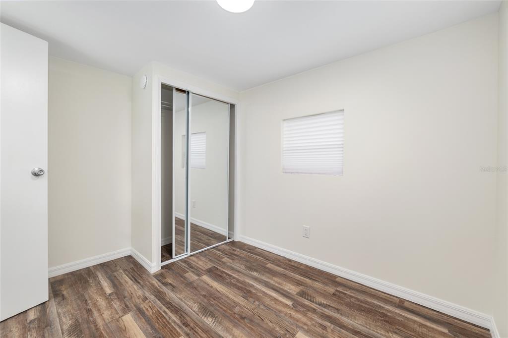 905 South Sunfish Avenue Inverness, FL 34450 - Photo 27 of 39 a view of an empty room with wooden floor