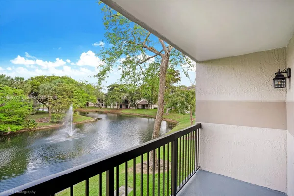a view of swimming pool from a balcony