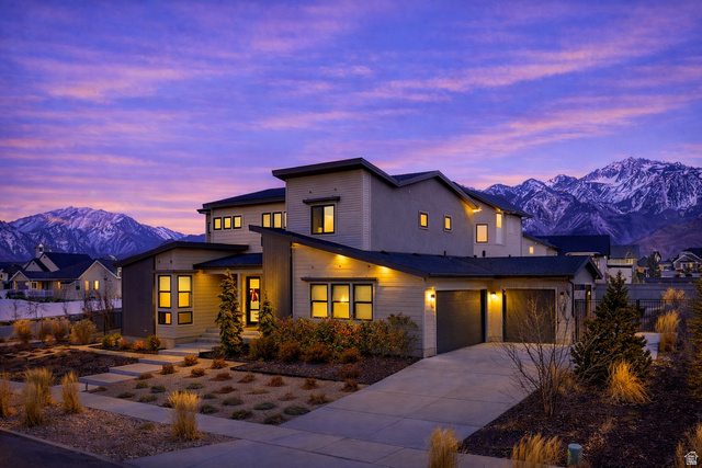 11617 South Wildrye Field Way Draper, UT 84020 - Photo 47 of 53 Modern home with beautiful mountain views, concrete driveway, and an attached large 3-car garage