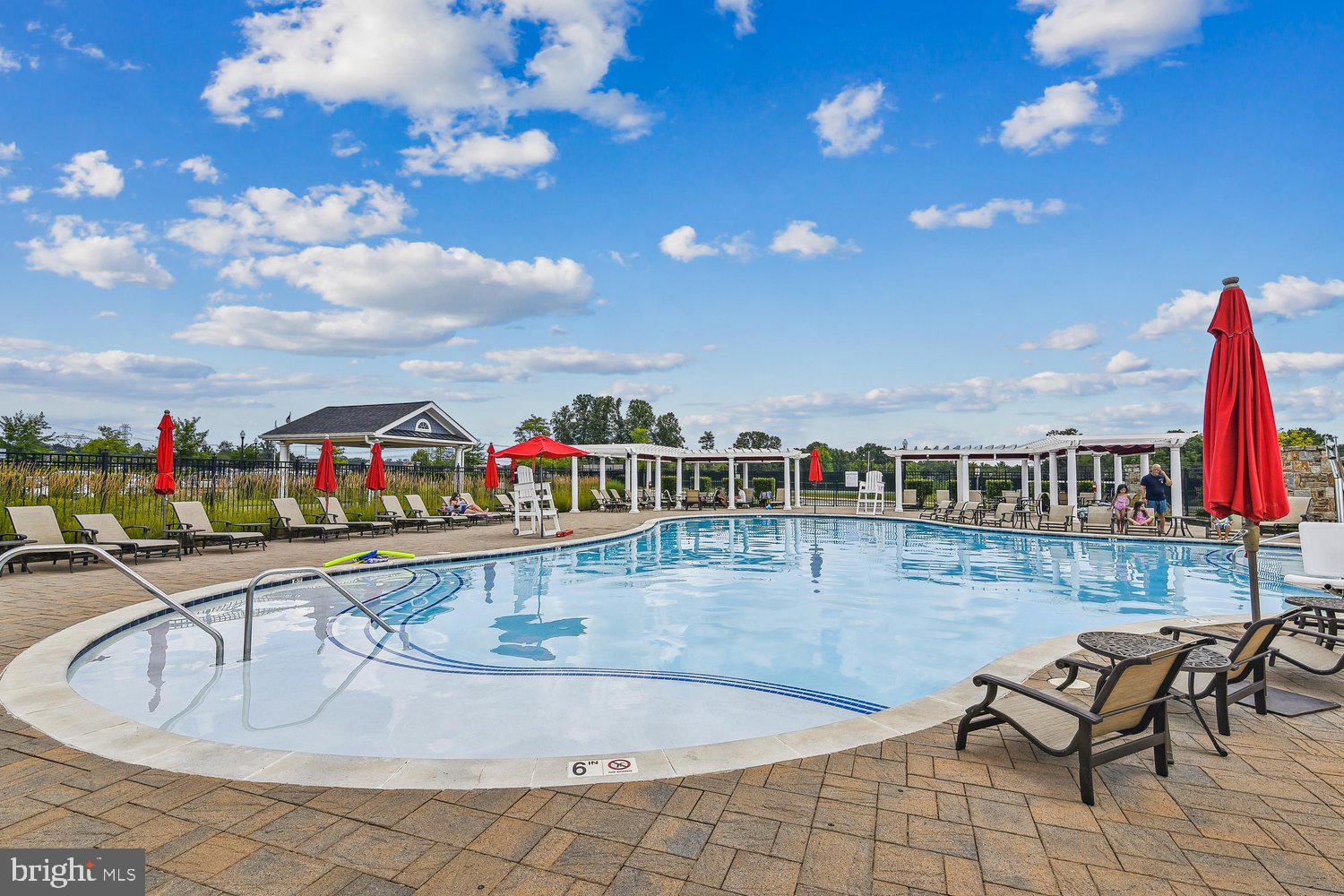 3068 Spring Peeper Court Odenton, MD 21113 - Photo 36 of 42 a swimming pool with outdoor seating and city view