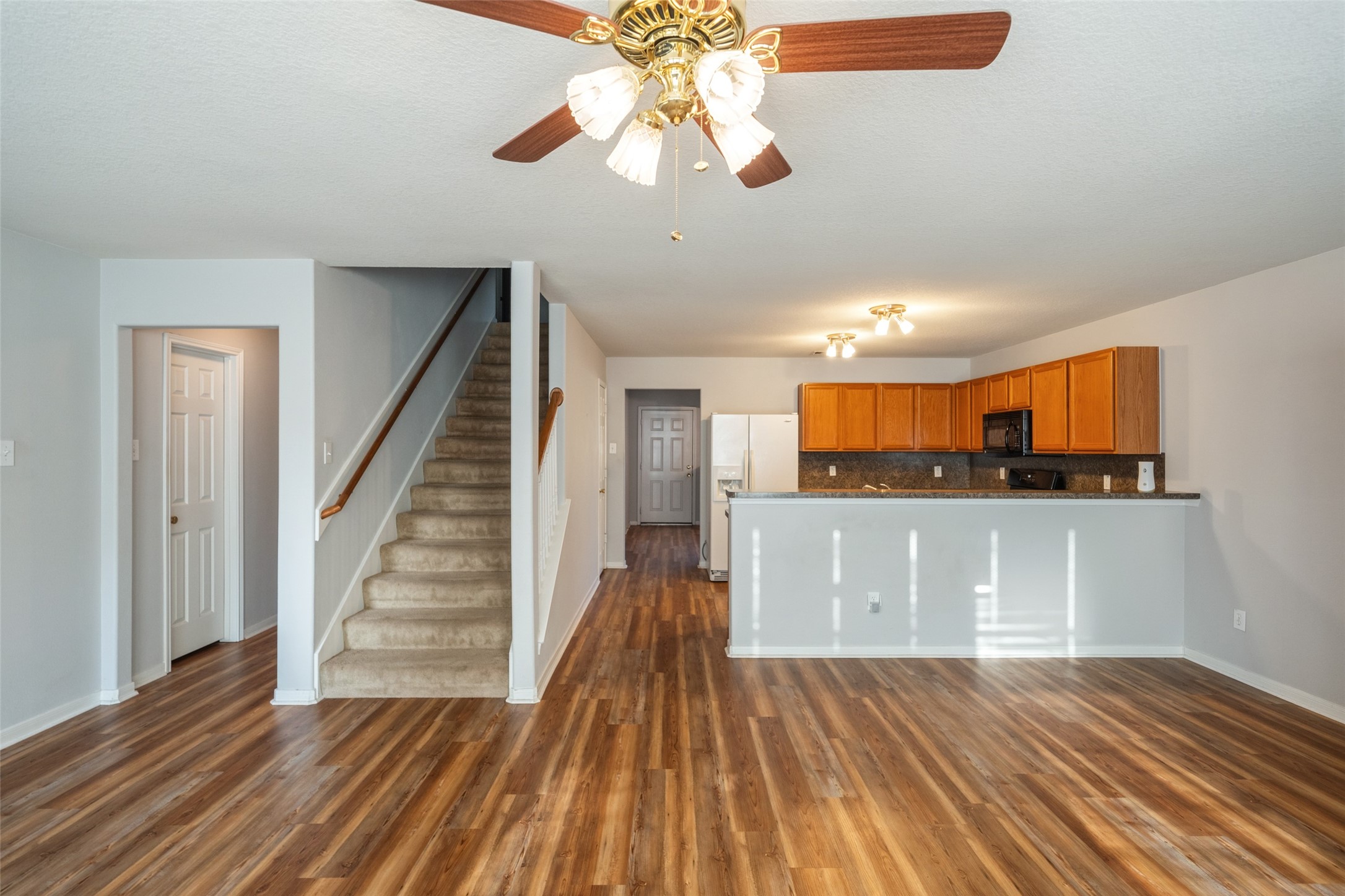 16820 Infield Court Conroe, TX 77385 - Photo 20 of 44 a view of a room with wooden floor and staircase
