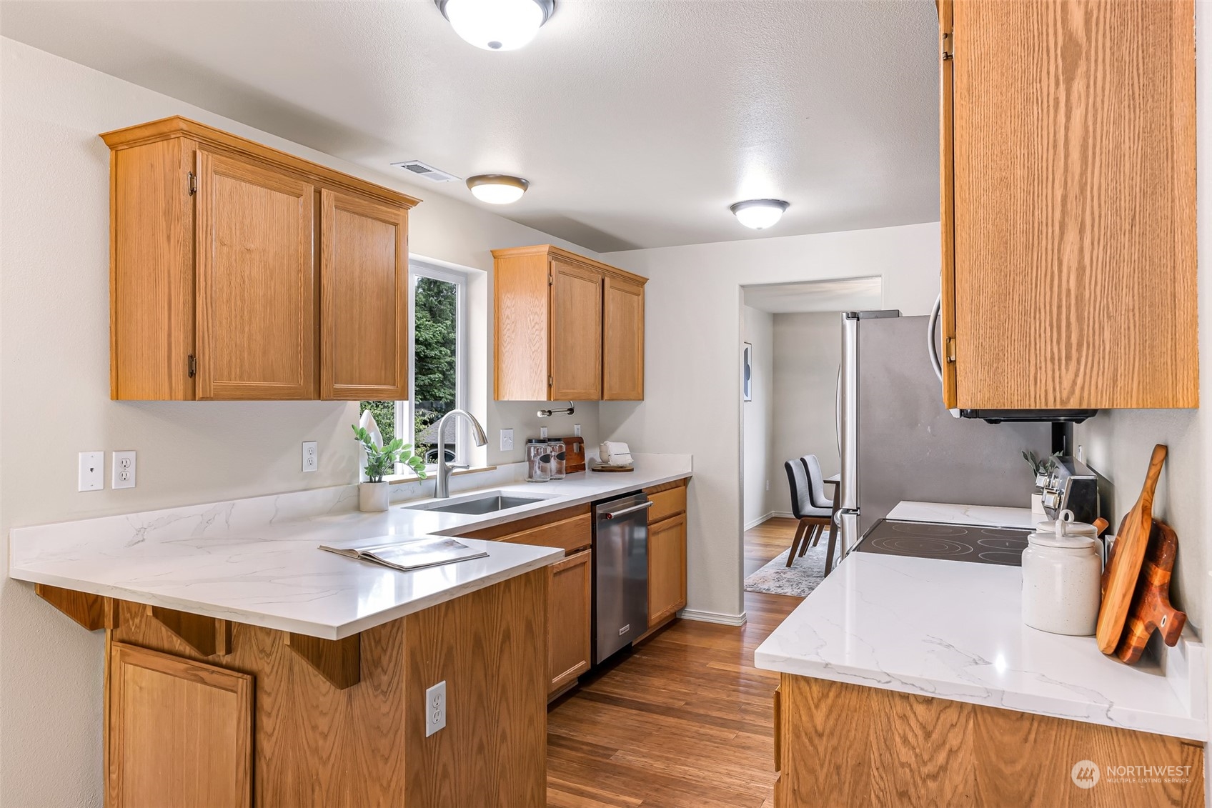 14423 Southeast 188 Way Renton, WA 98058 - Photo 12 of 40 a kitchen with a sink stove and cabinets