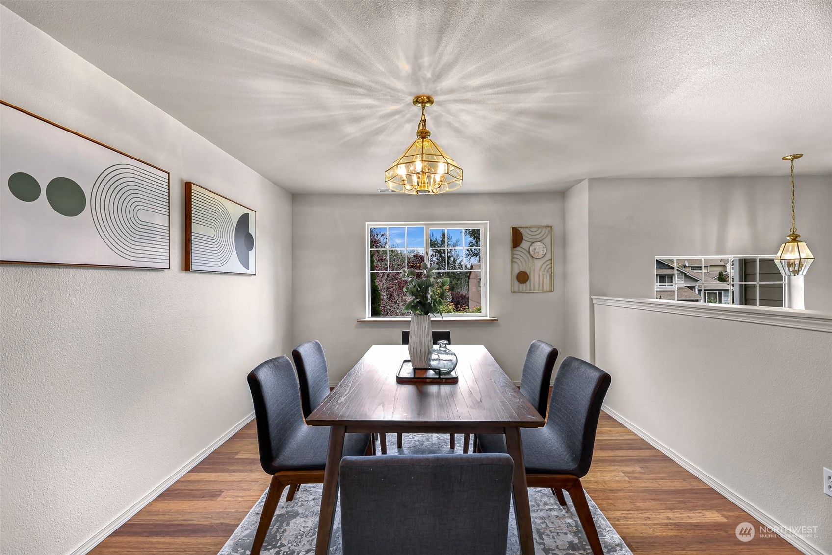14423 Southeast 188 Way Renton, WA 98058 - Photo 15 of 40 a view of a dining room with furniture window and wooden floor