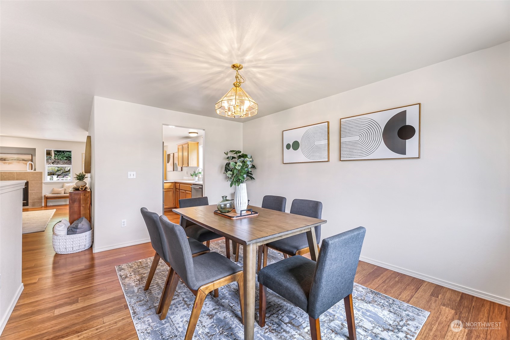 14423 Southeast 188 Way Renton, WA 98058 - Photo 16 of 40 a view of a dining room with furniture and wooden floor
