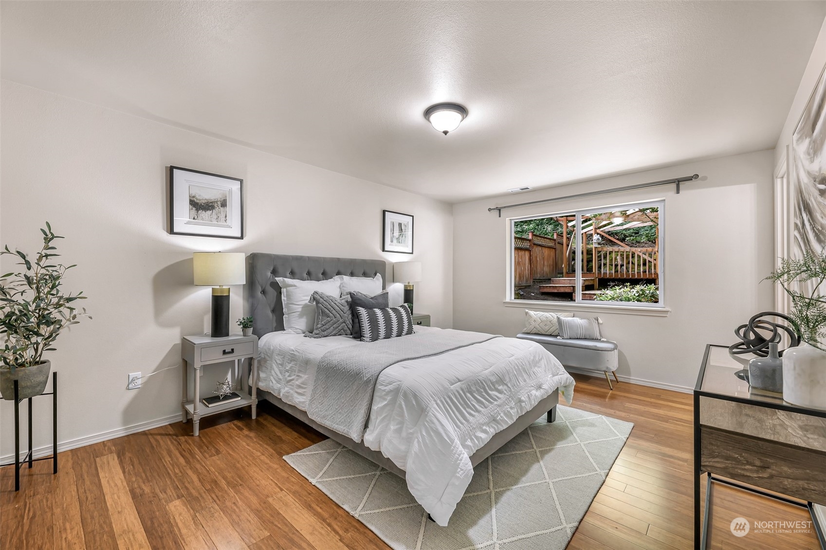 14423 Southeast 188 Way Renton, WA 98058 - Photo 17 of 40 a bedroom with a bed and wooden floor