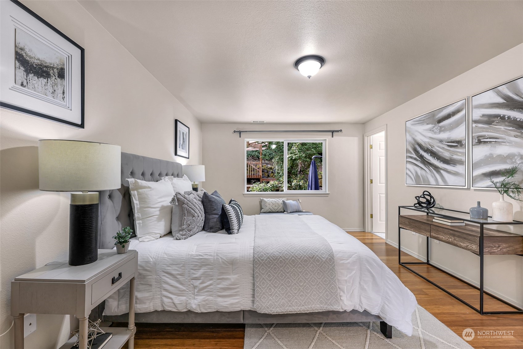 14423 Southeast 188 Way Renton, WA 98058 - Photo 18 of 40 a bedroom with a bed and wooden floor