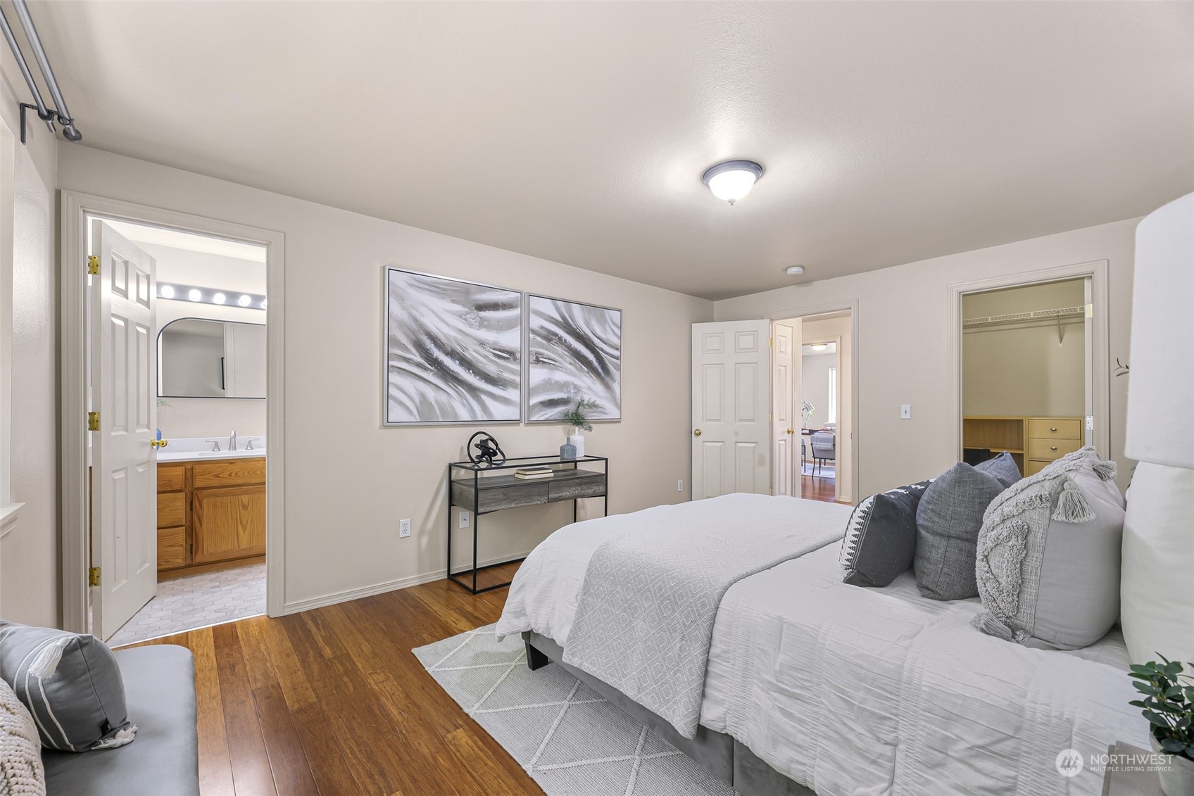 14423 Southeast 188 Way Renton, WA 98058 - Photo 19 of 40 a bedroom with a bed and wooden floor