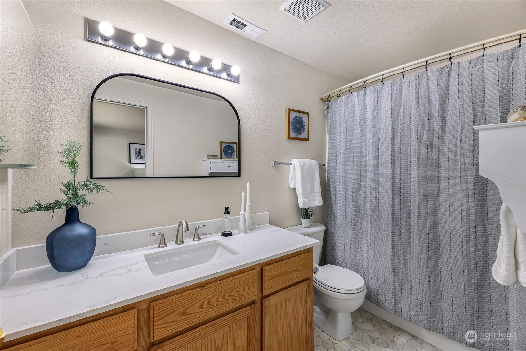 14423 Southeast 188 Way Renton, WA 98058 - Photo 20 of 40 a bathroom with a toilet a sink and mirror