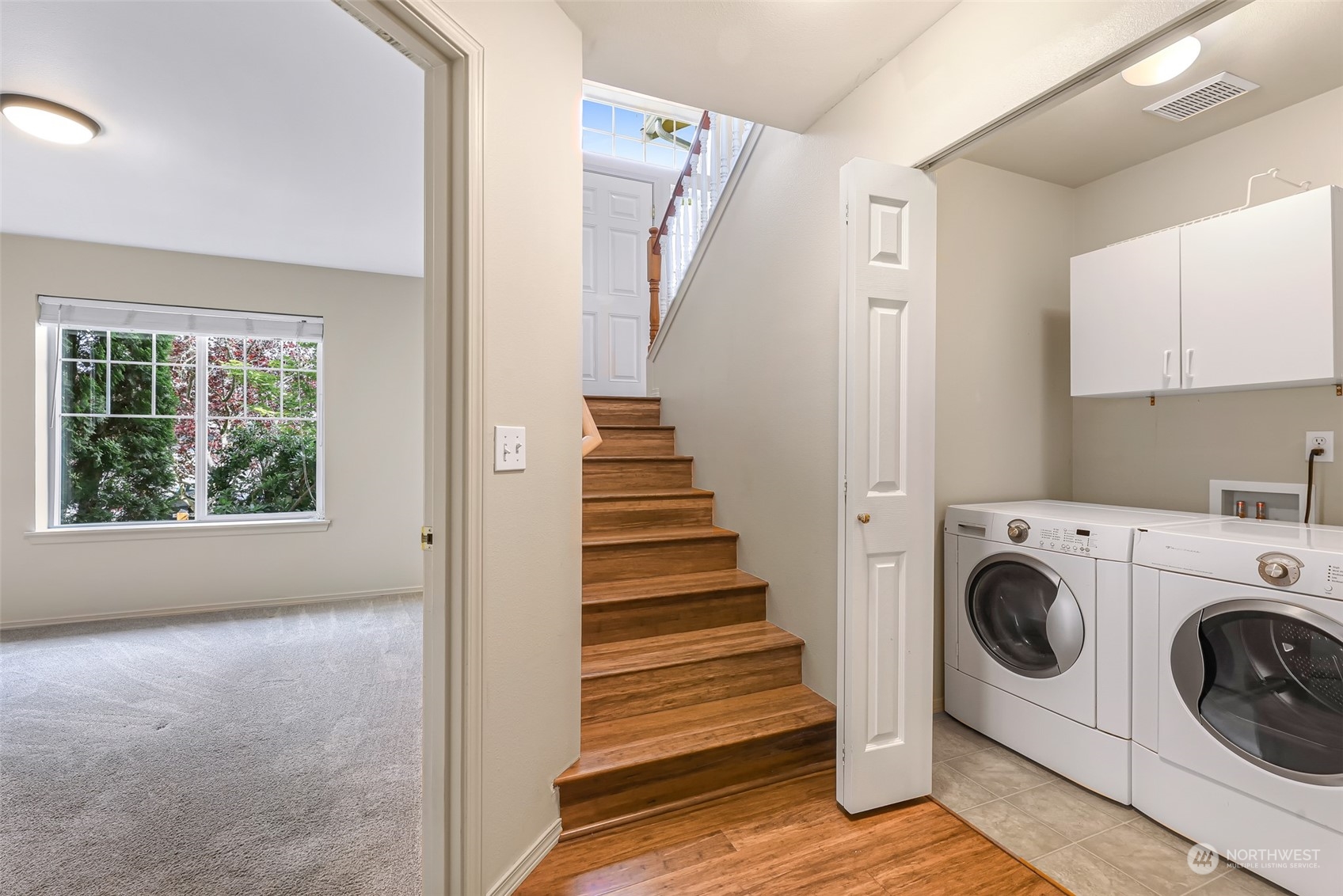 14423 Southeast 188 Way Renton, WA 98058 - Photo 28 of 40 a view of a hallway with washer and dryer