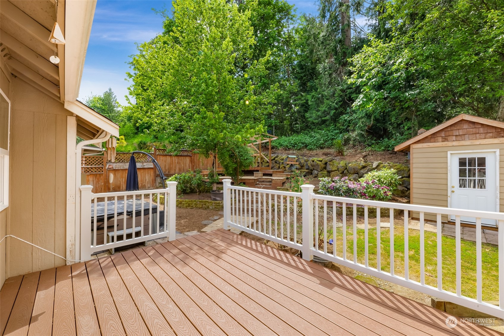 14423 Southeast 188 Way Renton, WA 98058 - Photo 36 of 40 a view of a wooden deck with large trees and wooden fence