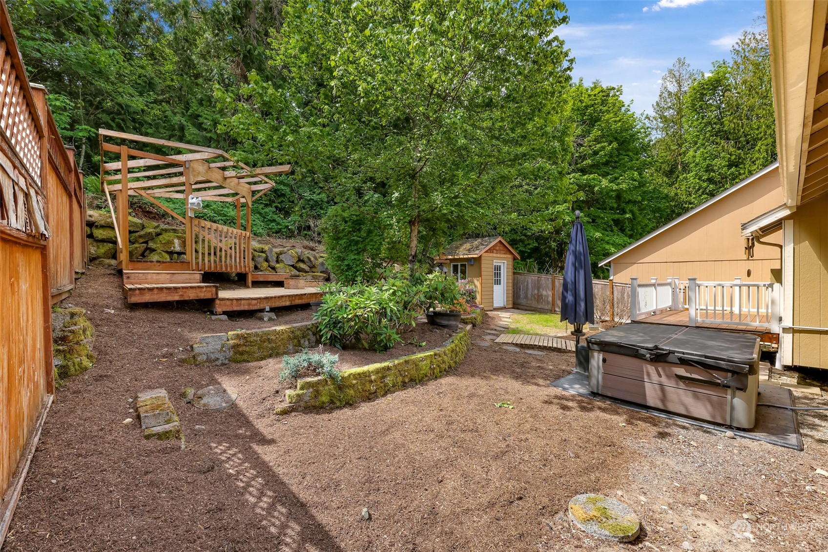 14423 Southeast 188 Way Renton, WA 98058 - Photo 39 of 40 a view of a house with backyard and sitting area