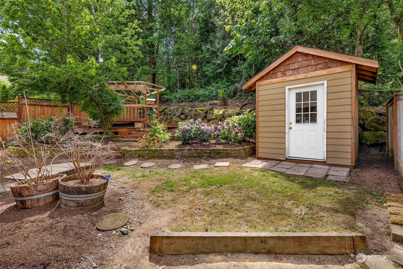 14423 Southeast 188 Way Renton, WA 98058 - Photo 40 of 40 a front view of a house with garden