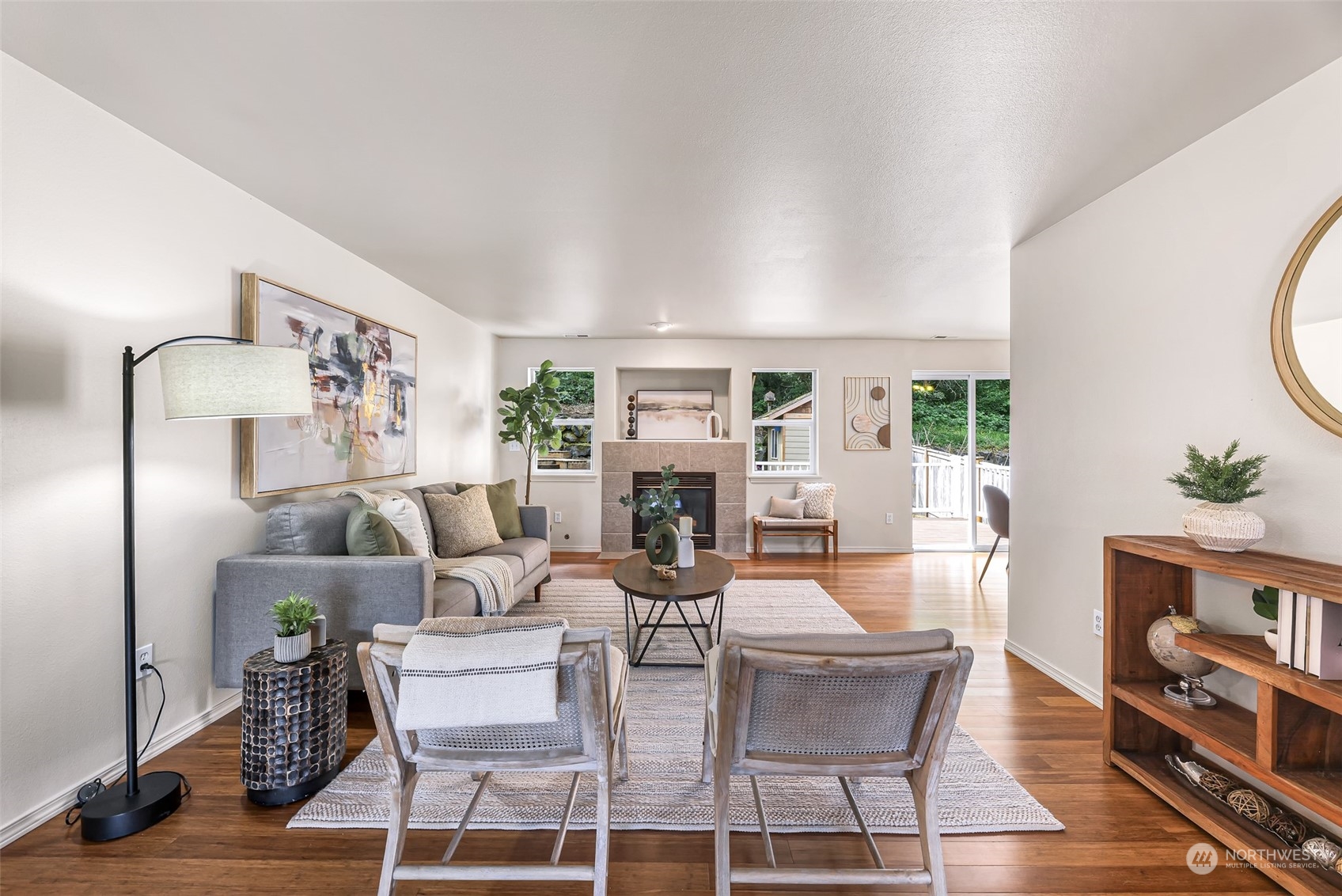 14423 Southeast 188 Way Renton, WA 98058 - Photo 4 of 40 a living room with furniture a fireplace and a potted plant