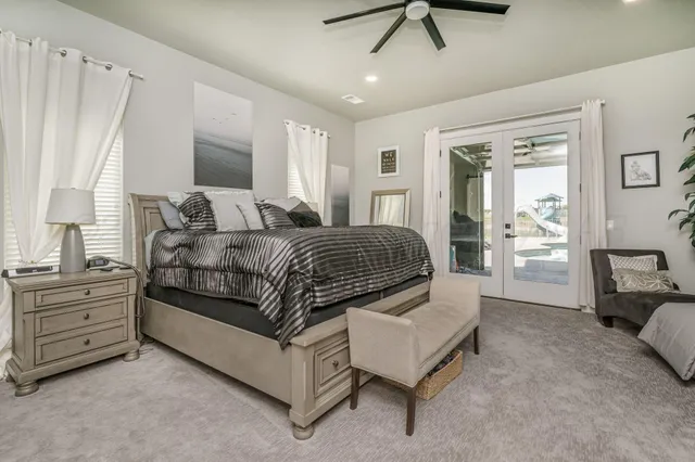 a bathroom with a double vanity sink a mirror and a shower