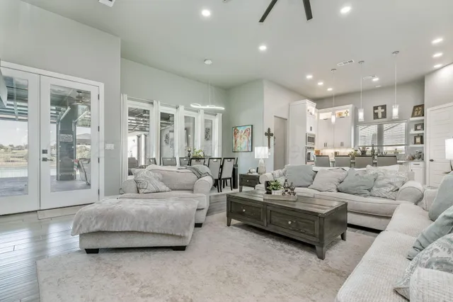 a living room with furniture and a large window