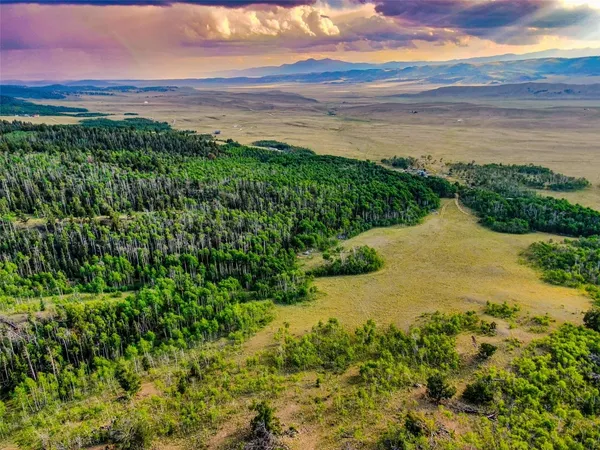 a view of an ocean and a mountain