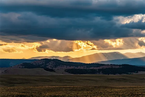 a view of mountain with sunset view