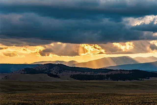 a view of mountain with sunset view