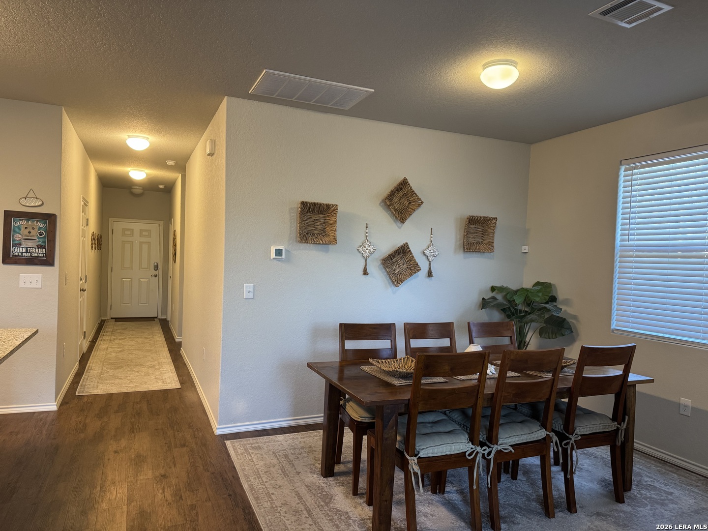 6627 Freedom Ranch San Antonio, TX 78242 - Photo 5 of 10 a view of a dining room with furniture and wooden floor