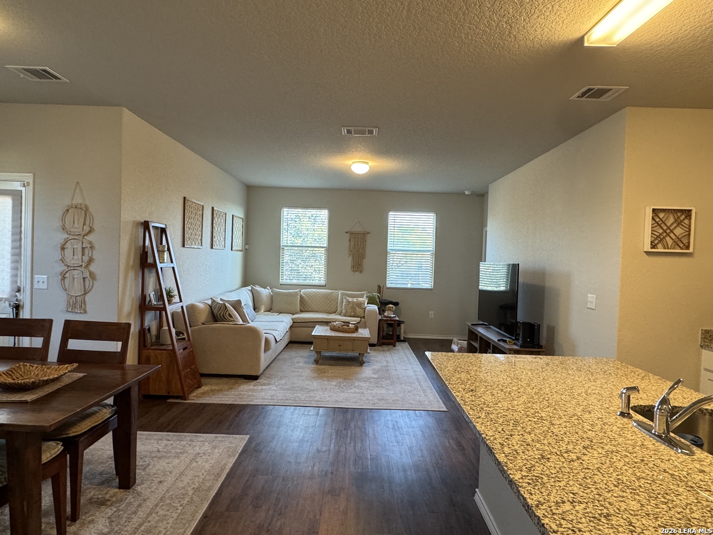 6627 Freedom Ranch San Antonio, TX 78242 - Photo 6 of 10 a living room with furniture rug and wooden floor