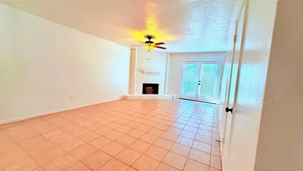 a view of a room with a fireplace