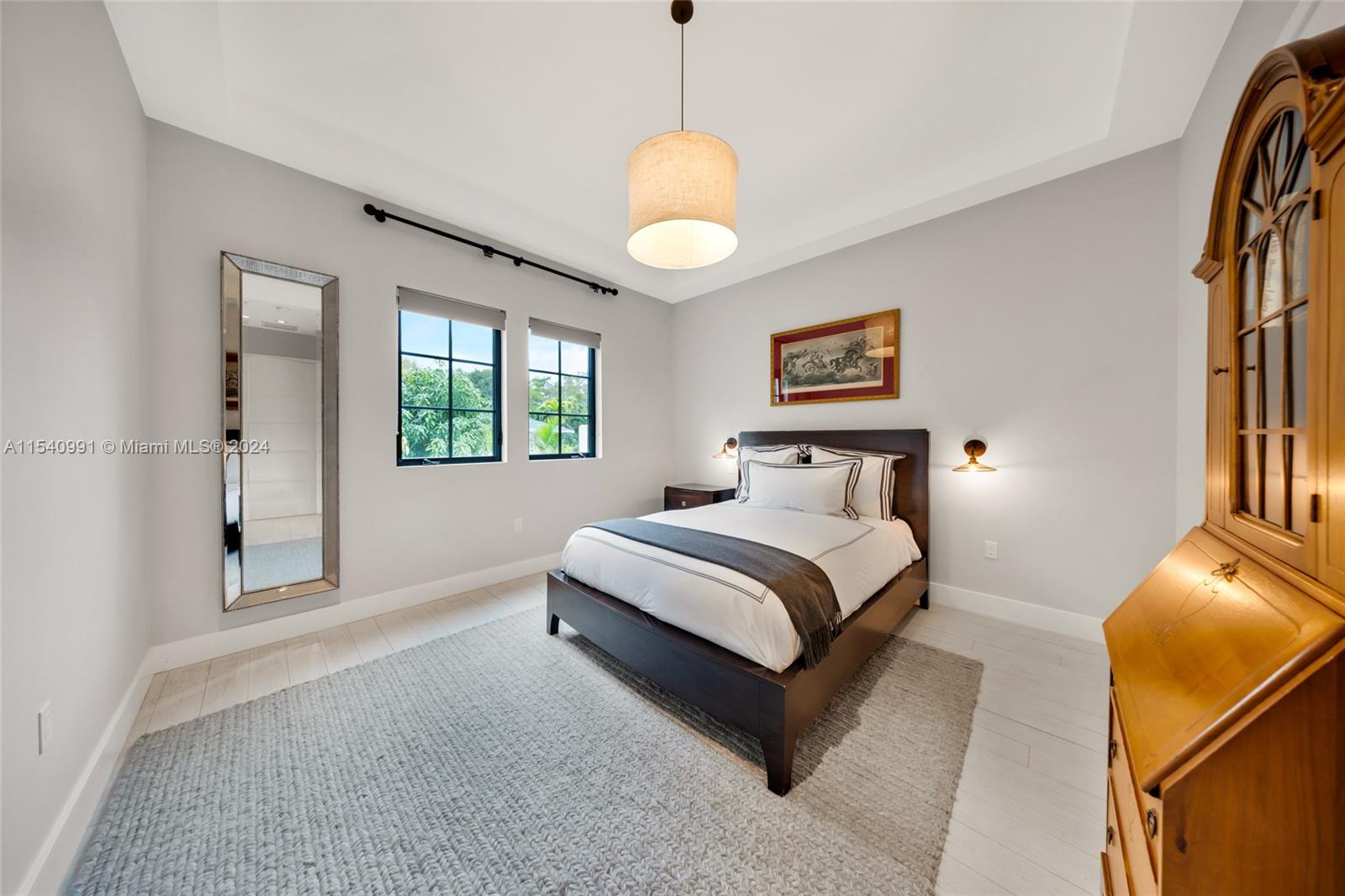 590 Northeast 59th Street Miami, FL 33137 - Photo 15 of 32 a bedroom with a bed and a window