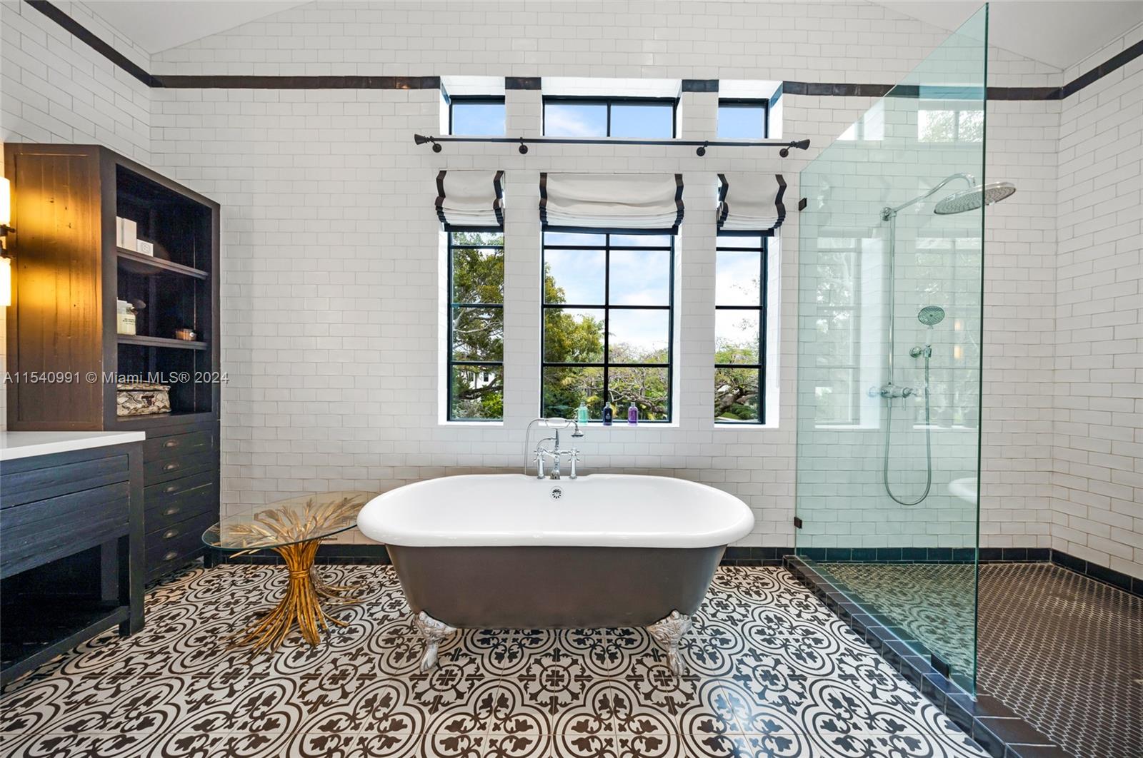 590 Northeast 59th Street Miami, FL 33137 - Photo 20 of 32 a bathroom with a sink and a mirror