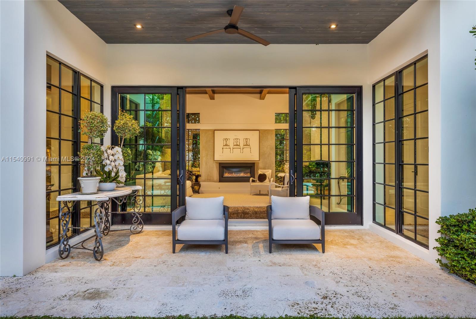 590 Northeast 59th Street Miami, FL 33137 - Photo 30 of 32 a bedroom with furniture and large windows