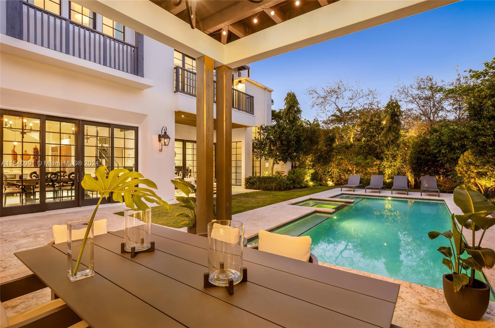 590 Northeast 59th Street Miami, FL 33137 - Photo 31 of 32 a swimming pool with outdoor seating and yard