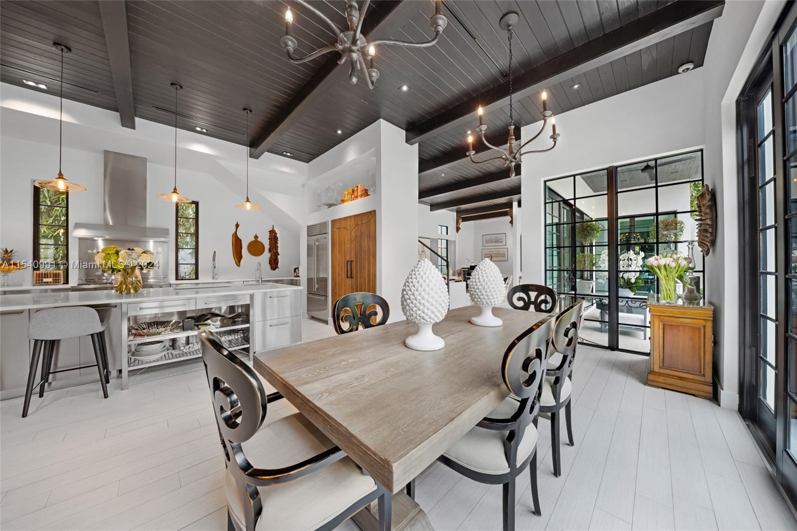 590 Northeast 59th Street Miami, FL 33137 - Photo 7 of 32 a view of a dining room with furniture window and wooden floor