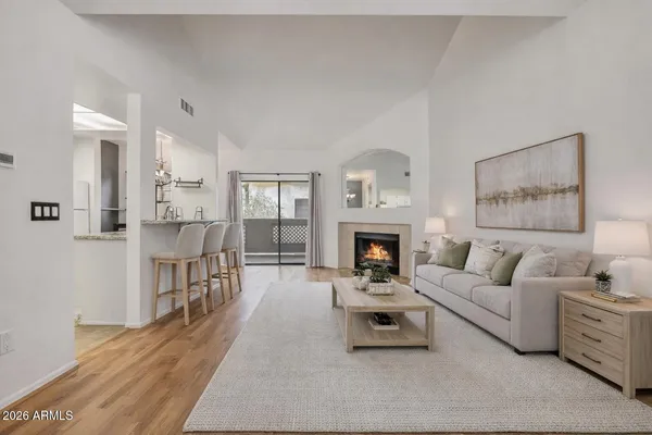 a living room with furniture and a fireplace