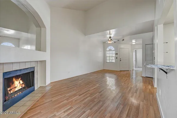 a view of an empty room and fire place