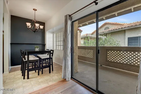 a view of a dining room with furniture window and outside view