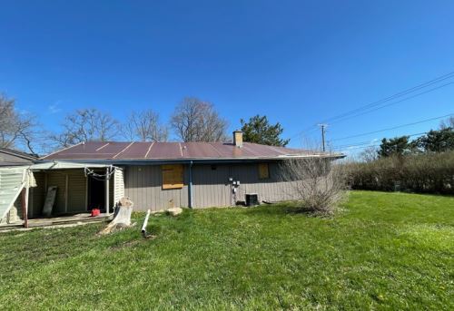 19W719 West Holtz Avenue Addison, IL 60101 - Photo 3 of 11 a front view of a house with a yard and garage