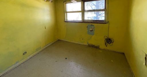 19W719 West Holtz Avenue Addison, IL 60101 - Photo 8 of 11 an empty room with a empty space and a window