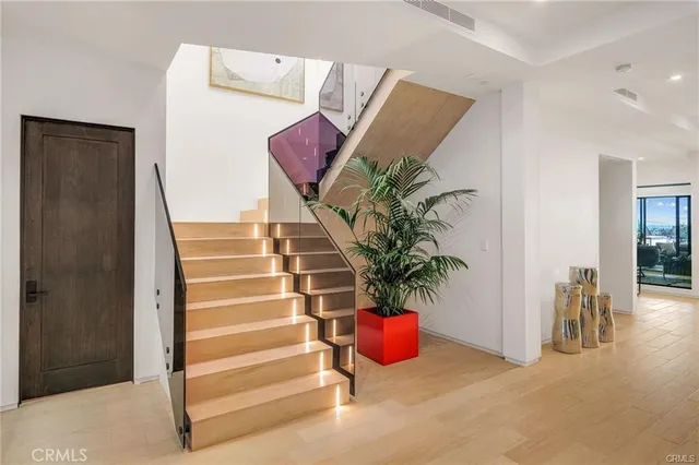 a living room with furniture floor to ceiling window and floor to ceiling window