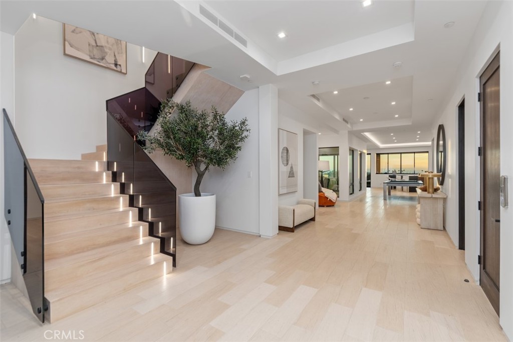1207 Dolphin Terrace Corona del Mar, CA 92625 - Photo 28 of 58 a living room with furniture and a potted plant