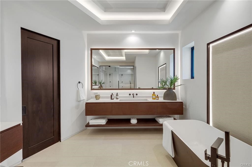 1207 Dolphin Terrace Corona del Mar, CA 92625 - Photo 3 of 58 a bathroom with a bathtub a mirror and a sink