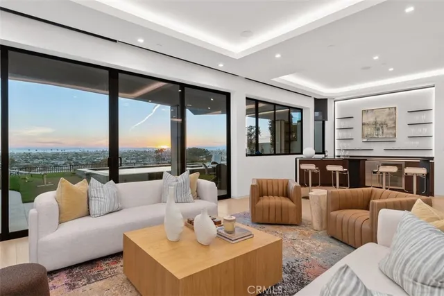 a kitchen with stainless steel appliances granite countertop a sink and a refrigerator