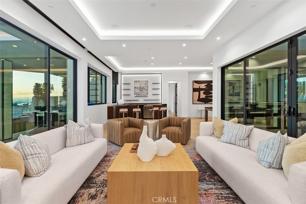1207 Dolphin Terrace Corona del Mar, CA 92625 - Photo 33 of 58 a living room with furniture and a large window