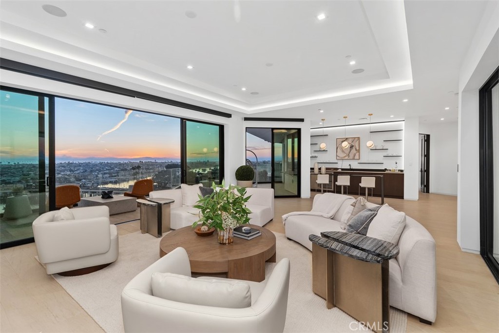 1207 Dolphin Terrace Corona del Mar, CA 92625 - Photo 36 of 58 a living room with furniture and a large window