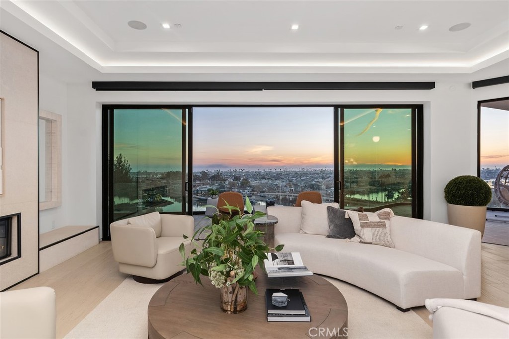 1207 Dolphin Terrace Corona del Mar, CA 92625 - Photo 37 of 58 a living room with furniture and a large window
