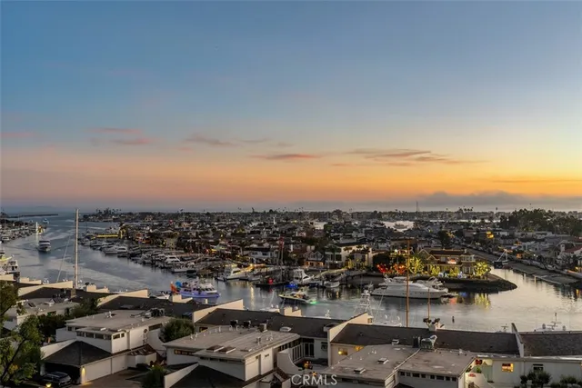 a living room with fireplace furniture and floor to ceiling window