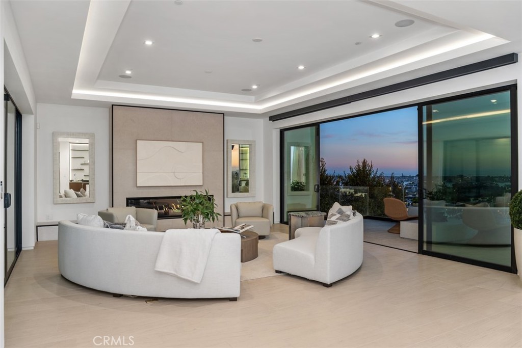 1207 Dolphin Terrace Corona del Mar, CA 92625 - Photo 44 of 58 a living room with couches and a large window