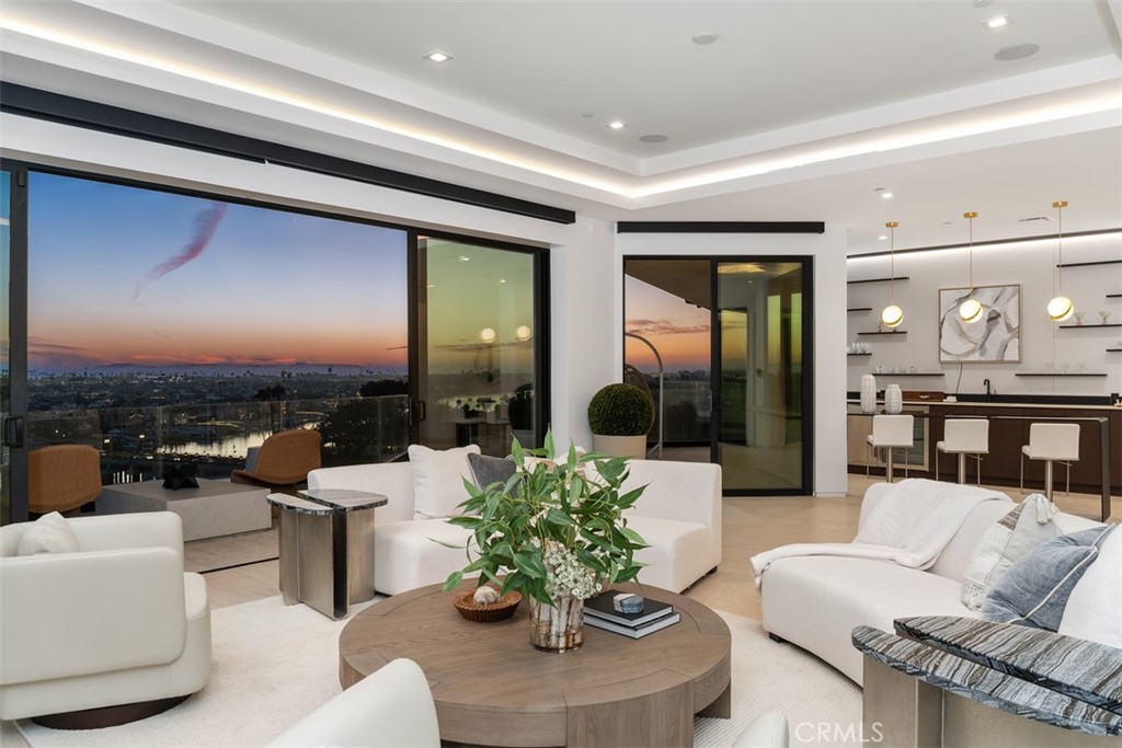 1207 Dolphin Terrace Corona del Mar, CA 92625 - Photo 45 of 58 a living room with furniture potted plant and a large window