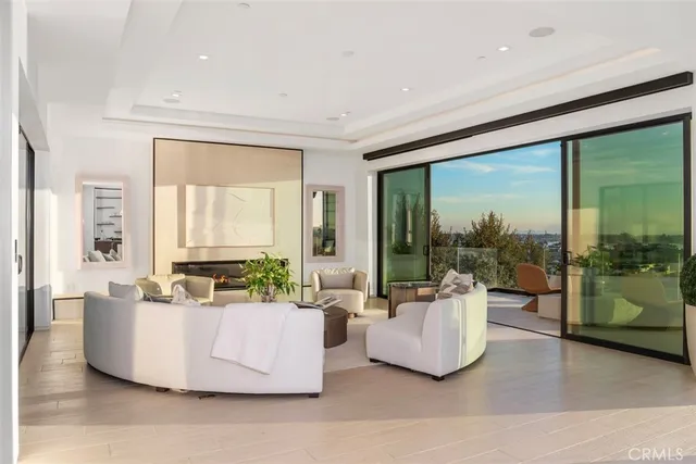 a kitchen with stainless steel appliances kitchen island granite countertop a table and chairs in it