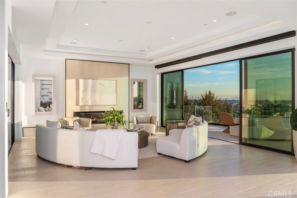 1207 Dolphin Terrace Corona del Mar, CA 92625 - Photo 46 of 58 a living room with furniture and a large window
