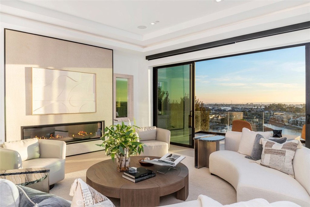 1207 Dolphin Terrace Corona del Mar, CA 92625 - Photo 47 of 58 a living room with furniture and a large window