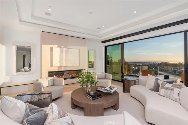 a dining room with furniture and a floor to ceiling window