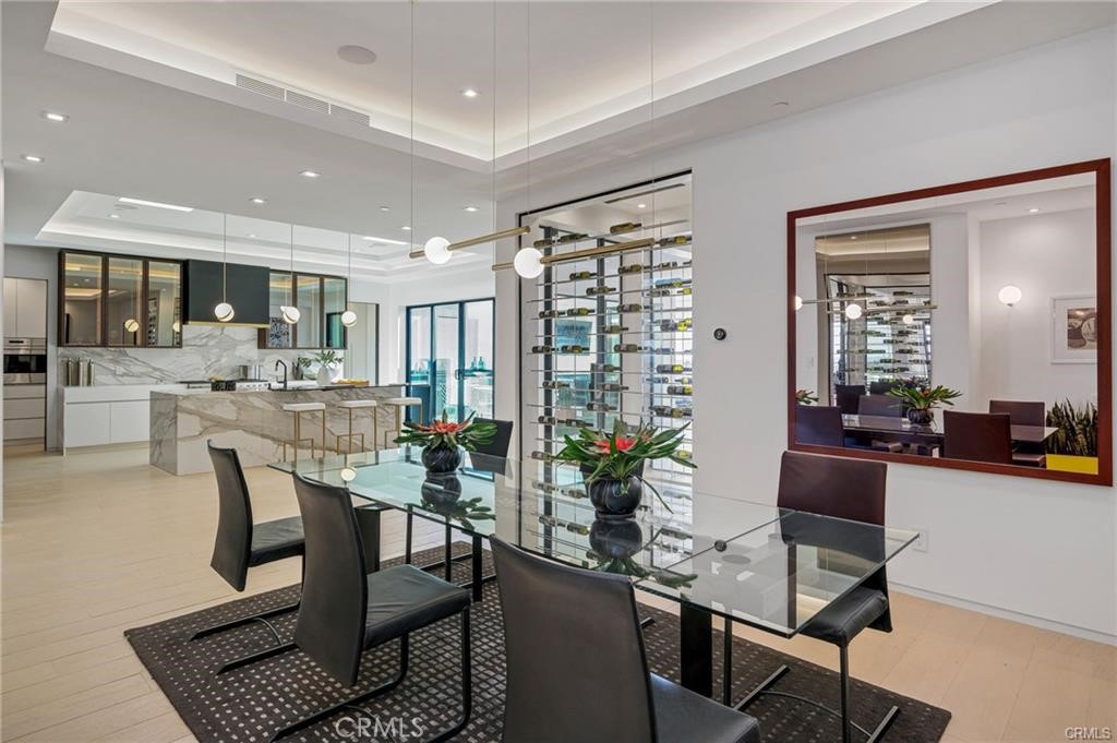 1207 Dolphin Terrace Corona del Mar, CA 92625 - Photo 6 of 58 a dining room with furniture and wooden floor
